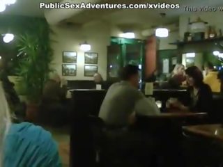 Blonde girl showing tits in the cafe
